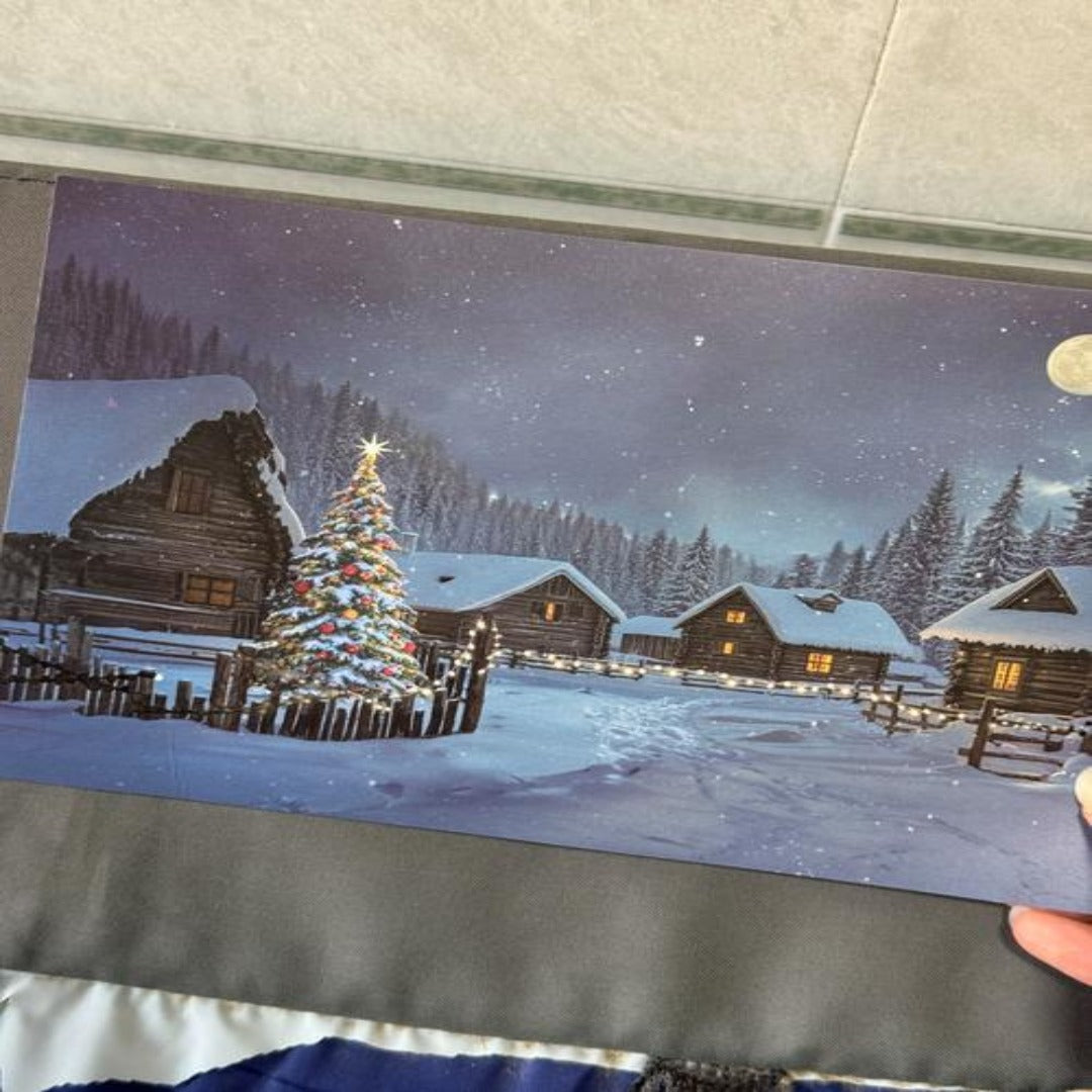 Cartolina LED illuminata del villaggio di Natale felice