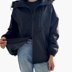 Giacca da donna con cappuccio e tasche con cerniera