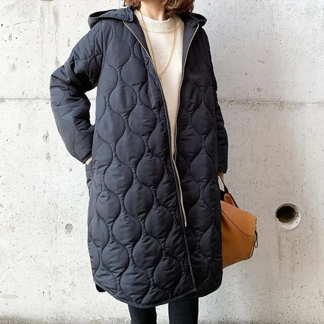 Cappotto invernale trapuntato | Design piumino con cappuccio lungo