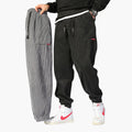 Pantaloni da jogging da uomo in velluto a coste con coulisse e polsini