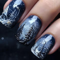 Nail art artistica nella foresta invernale