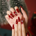 Elegante nail art a pressione a tema natalizio