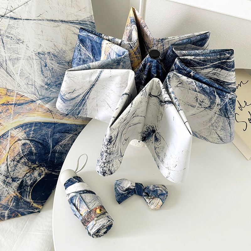 Ombrello pieghevole da donna dal design artistico e meccanismo di apertura automatica