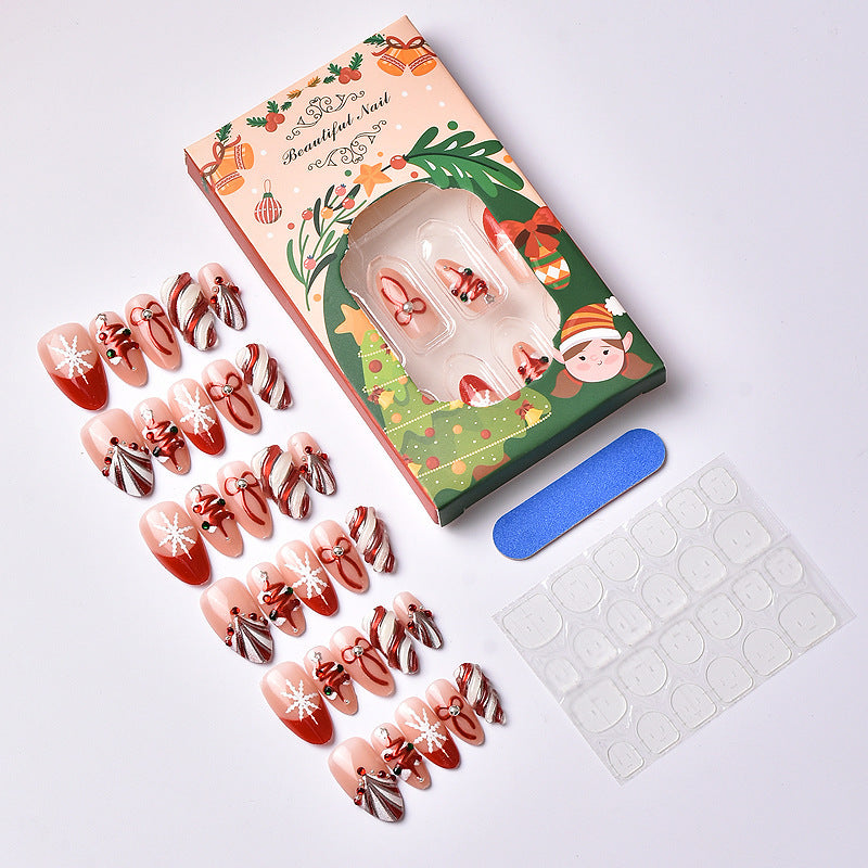 Set per unghie artificiali con motivi festivi natalizi e decorazioni eleganti