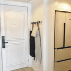 Appendiabiti da parete in ghisa nera con design ondulato per ingresso, camera da letto o bagno