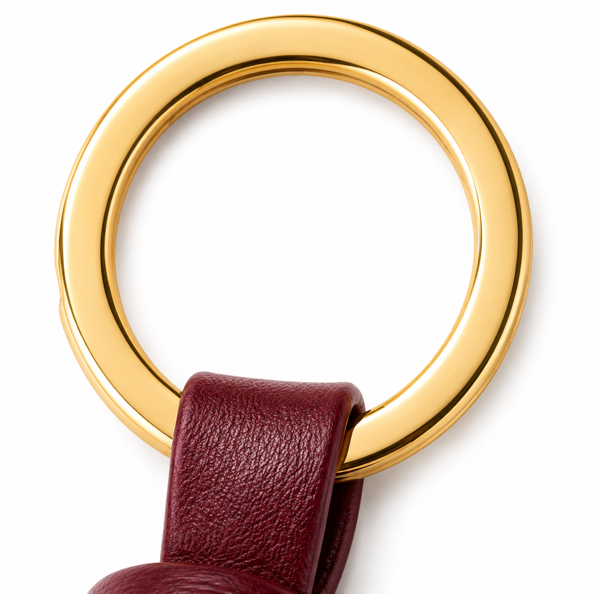 Anello dorato del portachiavi in pelle bordeaux.