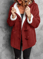 Elegante cappotto con cappuccio con design unico a bottoni