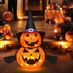 Decorazione di zucca di Halloween illuminata con cappello da strega e mantello per decorazioni natalizie all'aperto e al coperto