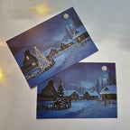 Cartolina LED illuminata del villaggio di Natale felice