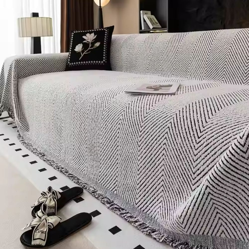 Coperta per divano con motivo a spina di pesce e bordi sfrangiati decorativi