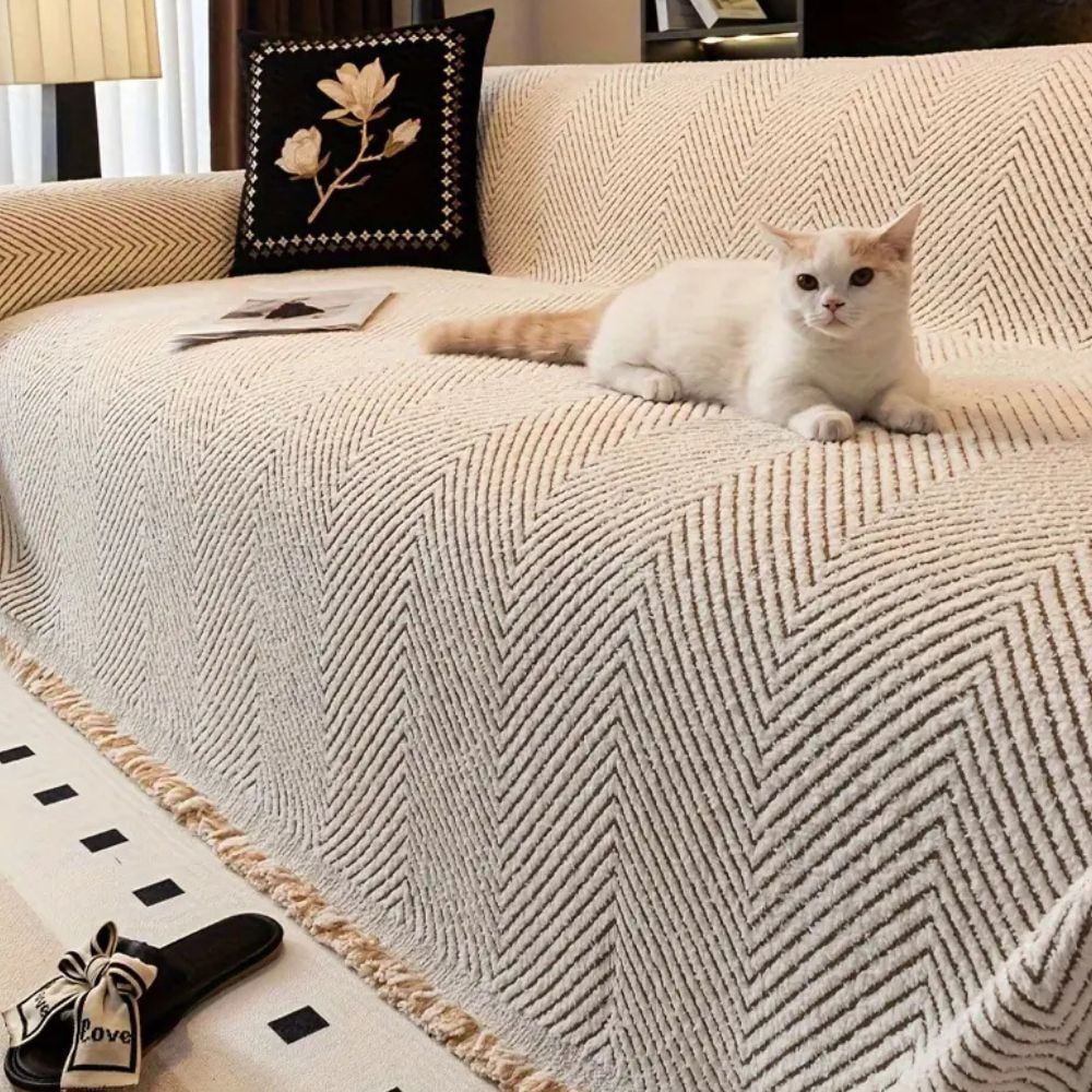 Coperta per divano con motivo a spina di pesce e bordi sfrangiati decorativi