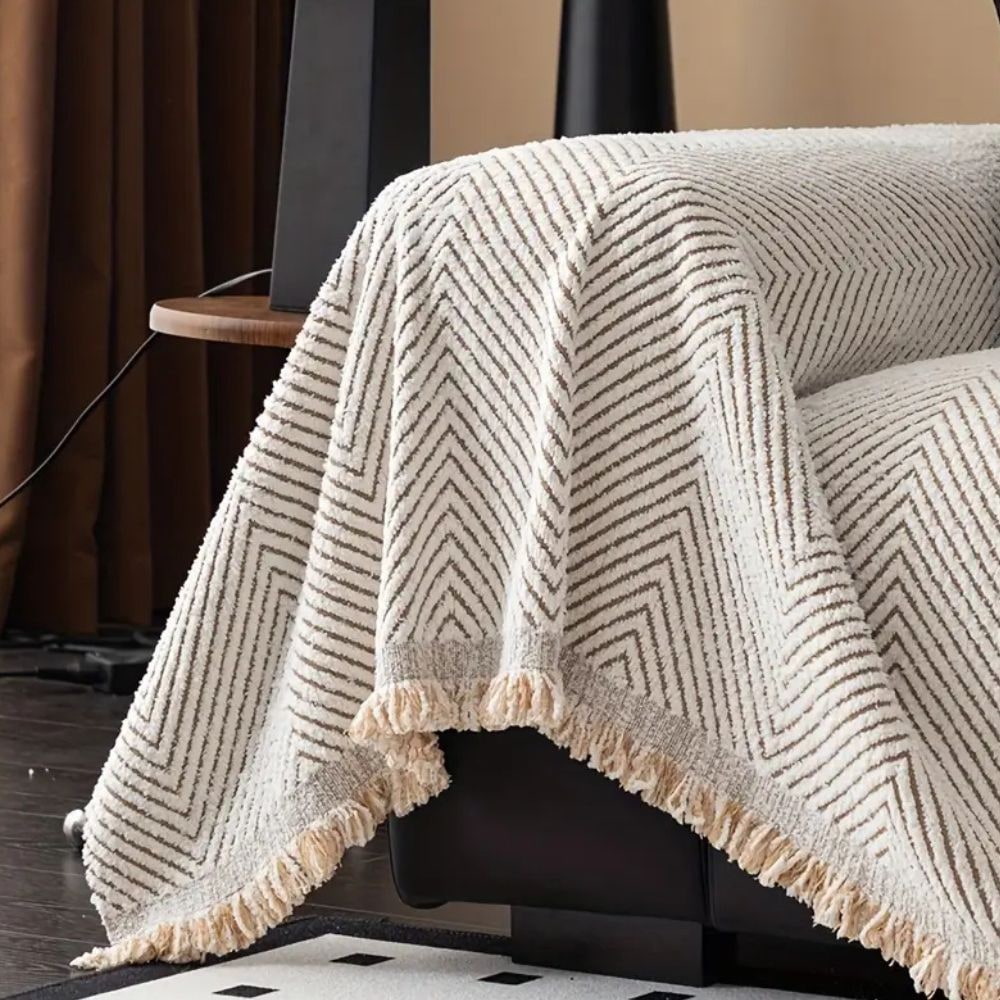 Coperta per divano con motivo a spina di pesce e bordi sfrangiati decorativi