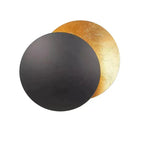 Applique da parete moderna Lunaris — struttura a dischi sovrapposti ispirata all'eclissi solare