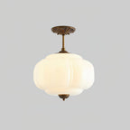Plafoniera vintage in vetro con dettagli in ottone, elegante lampada a soffitto