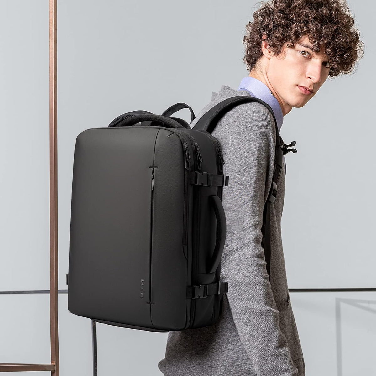 Zaino da viaggio impermeabile espandibile 26–45L con scomparto laptop e modalità borsone